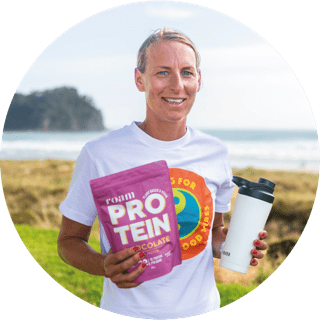 Rebecca Clarke Pro Triathlete Holding Roam Protein and Protein Shaker