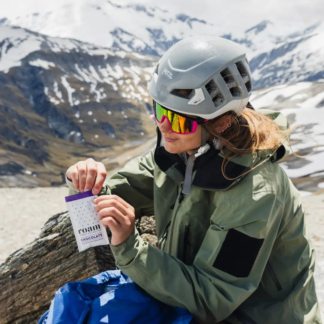 Energy Nut Butter Snack in Mountains with Mountaineer