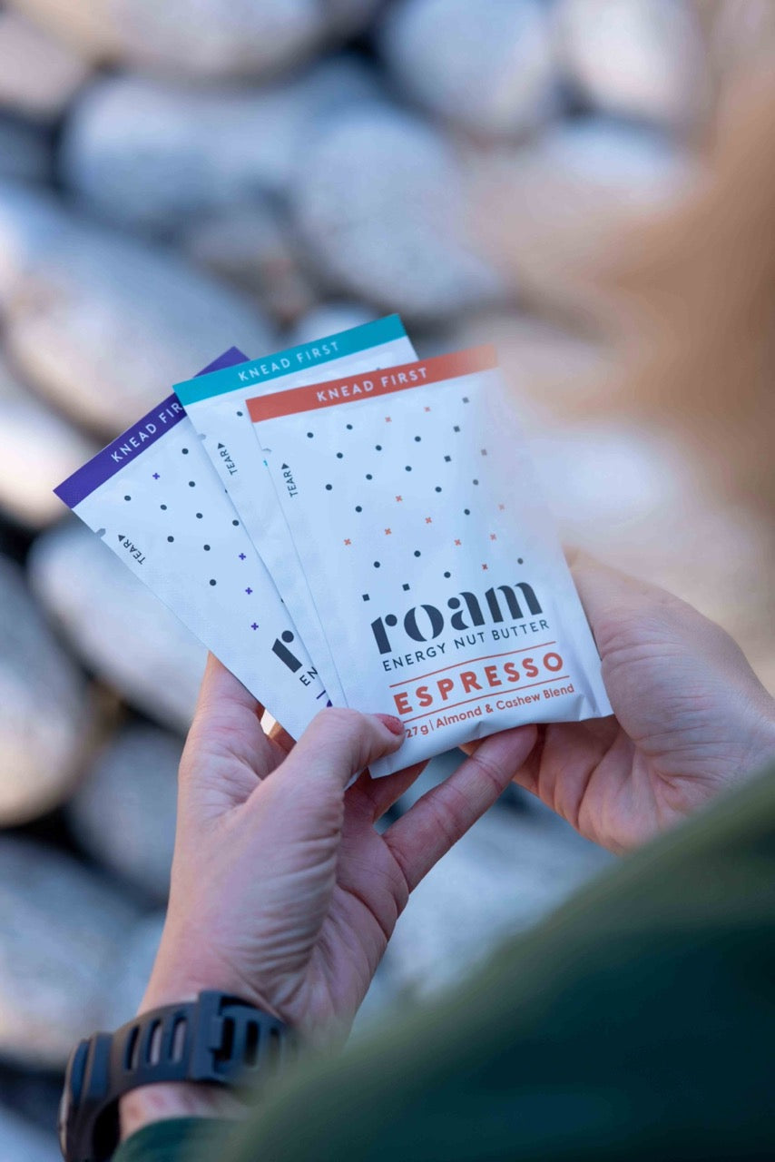 Female hands holding three Roam Energy Nut Butter Packets | Roam | NZ Australia