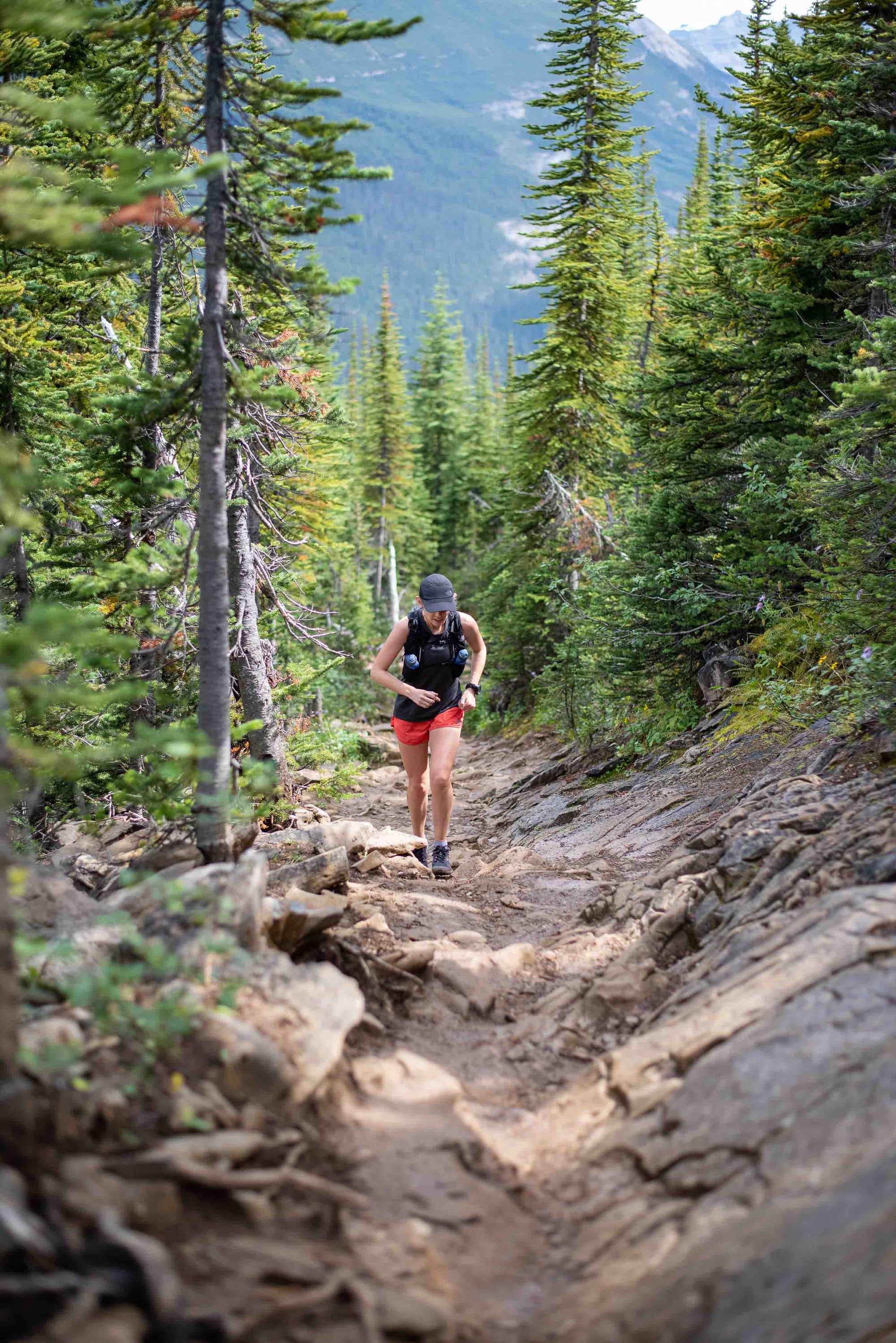 Female Trail Runner Running up rocky trail | Roam | NZ Australia