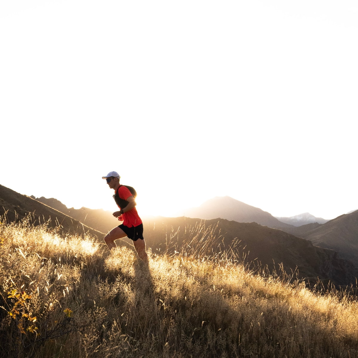 Cam Kerr Running Up Mountain at Dusk