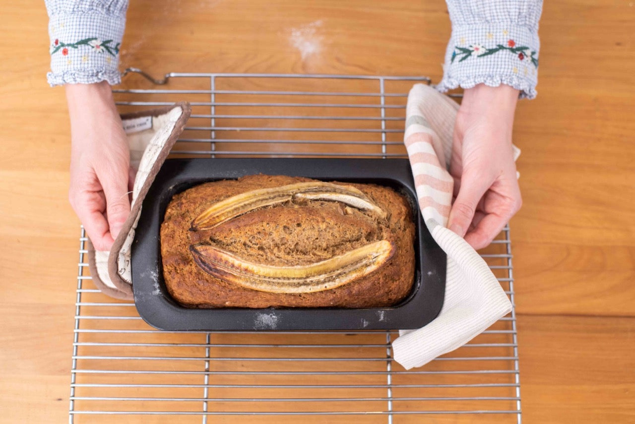 Freshly baked high-protein banana bread still in the loaf pan