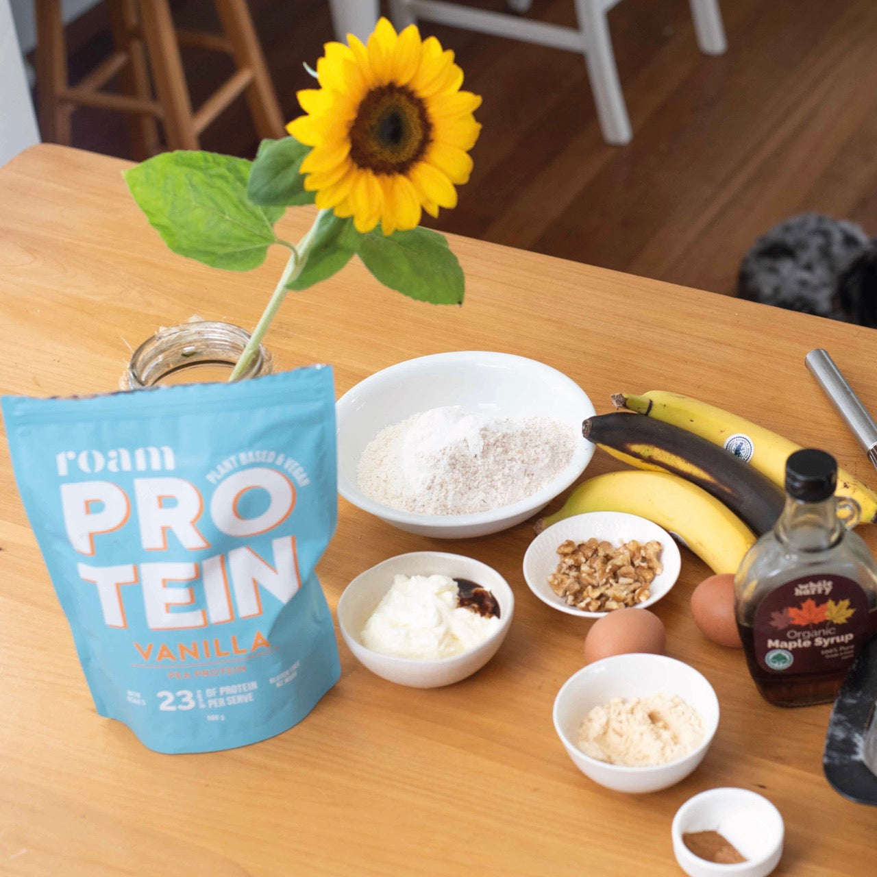 Ingredients for high-protein banana bread including Roam Protein powder and bananas