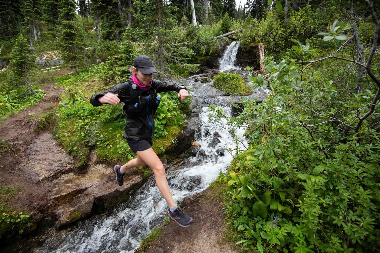 Female Jumping across stream | Roam | NZ Australia